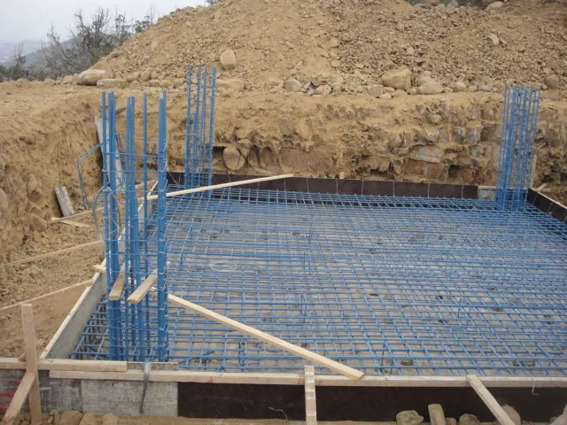 Civil foundation in progress: rebar and formwork