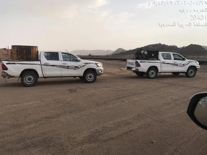 Field team vehicles en route to site